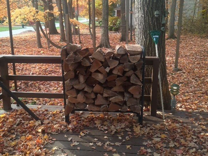 Firewood rack with fall leaves in Akron, Ohio