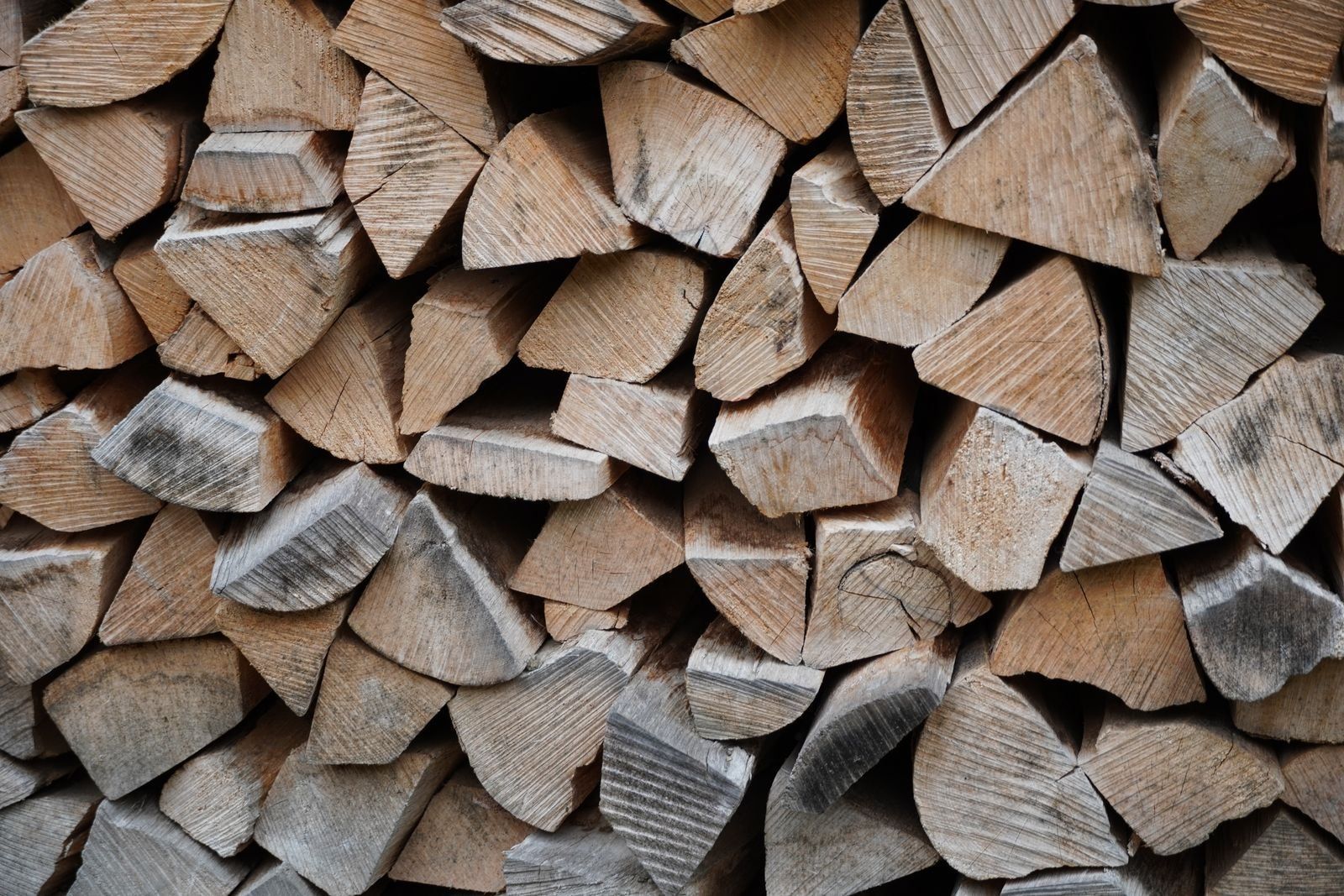 Close-up of split hardwood firewood pieces stacked tightly