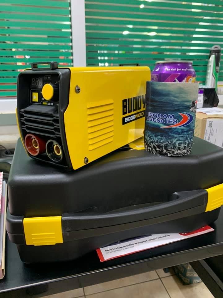 A Yellow Buddy Arc Welder Sits on Its Black Plastic Carrying Case — Ingham Agencies in Ingham, QLD
