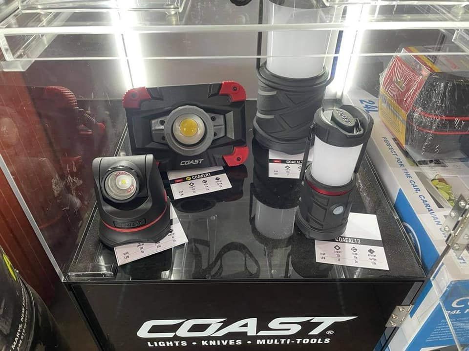 A Coast Display Case Featuring Three Portable Work Lights and Lanterns — Ingham Agencies in Ingham, QLD
