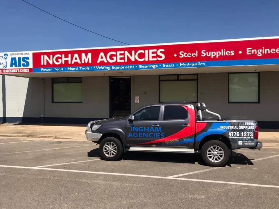 A Dark Gray Pickup Truck Parked in Front of the Ingham Agencies Building — Ingham Agencies in Ingham, QLD
