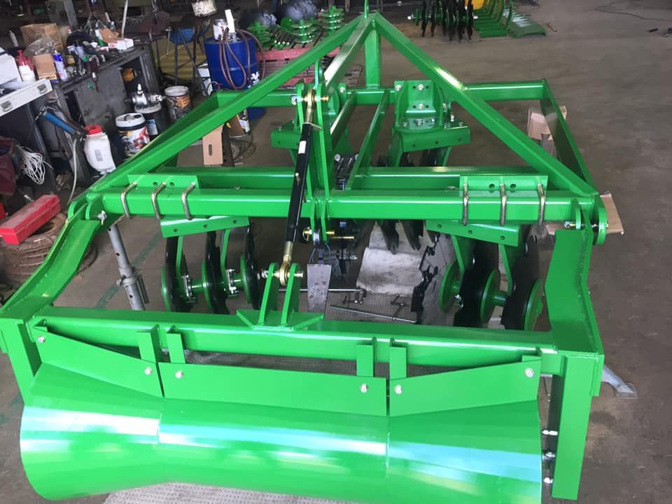 A Bright Green Agricultural Disc Harrow — Ingham Agencies in Ingham, QLD