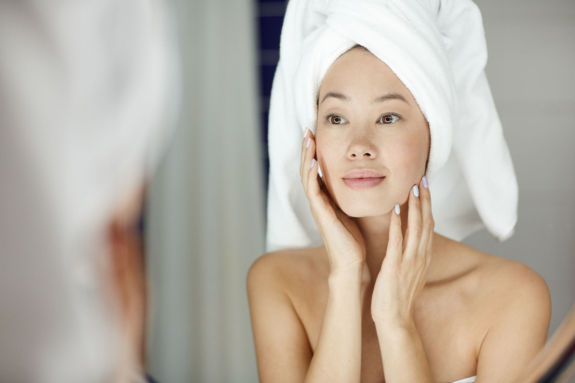 Woman looking at herself in mirror