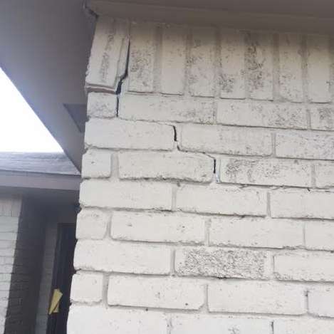 Crack in brick upper wall due to foundation damage