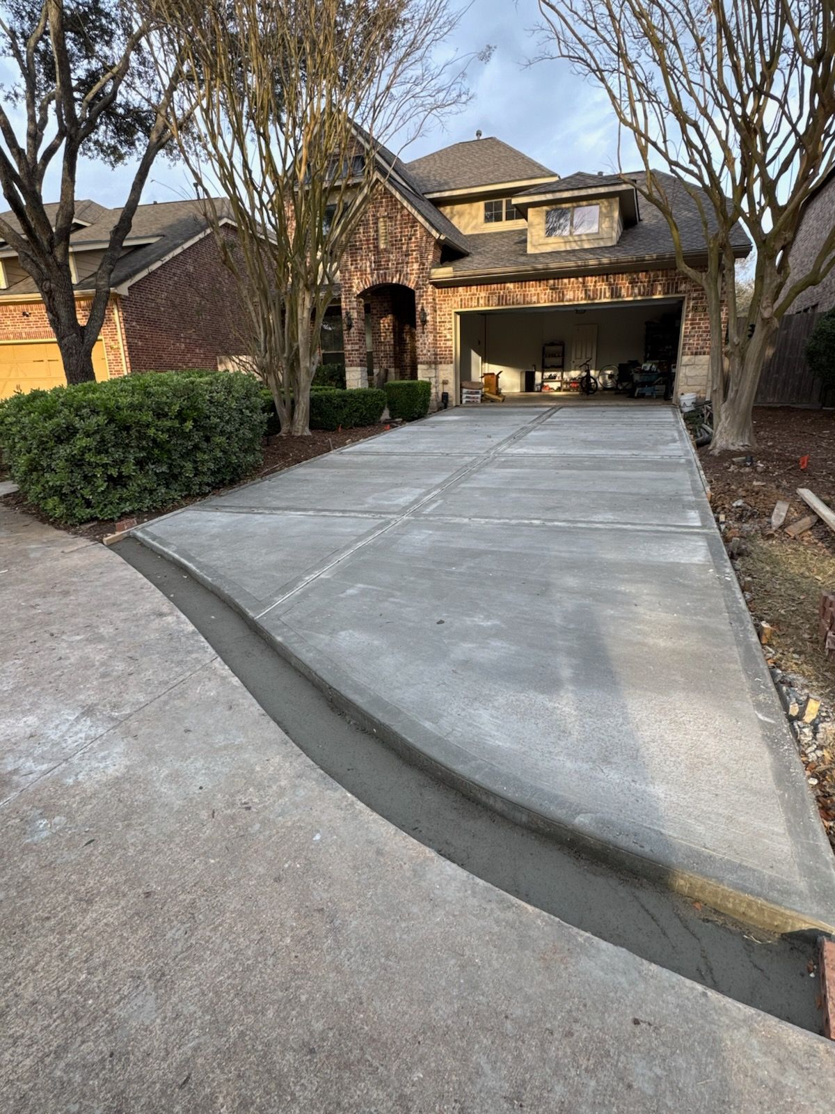 Leveled driveway at brick home after repair