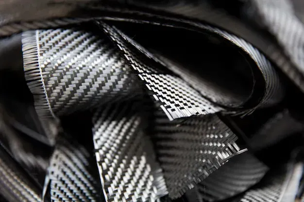 Close-up of high-strength carbon fiber material used for reinforcing foundation walls and preventing structural cracking.