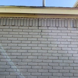 Cracked brick wall due to foundation damage