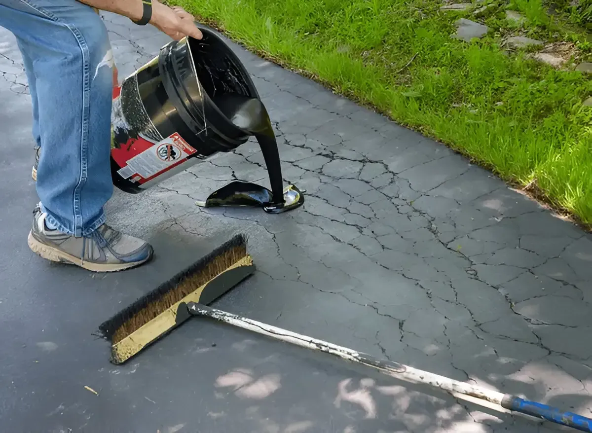 Repairing cracked concrete driveway to protect home foundation