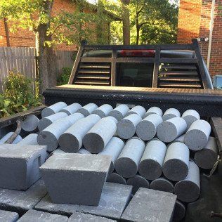 Concrete foundation piers in back of truck