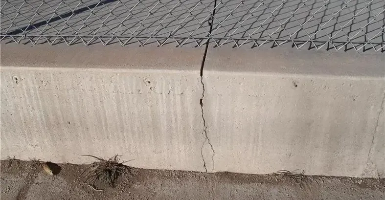 Vertical crack forming along a construction joint in a concrete foundation wall showing common signs of joint failure and separation
