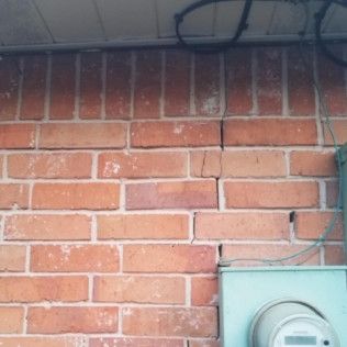 Cracked brick fixed from foundation repair after picture