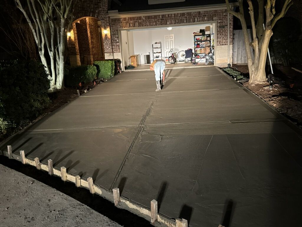 Repaired residential driveway at night