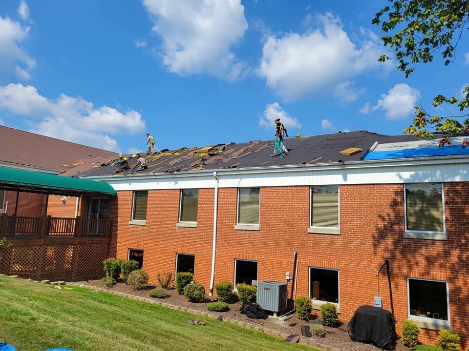 People Working on the Roof of the Large Building — Kingsport, TN — McMurray Boy's Roofing