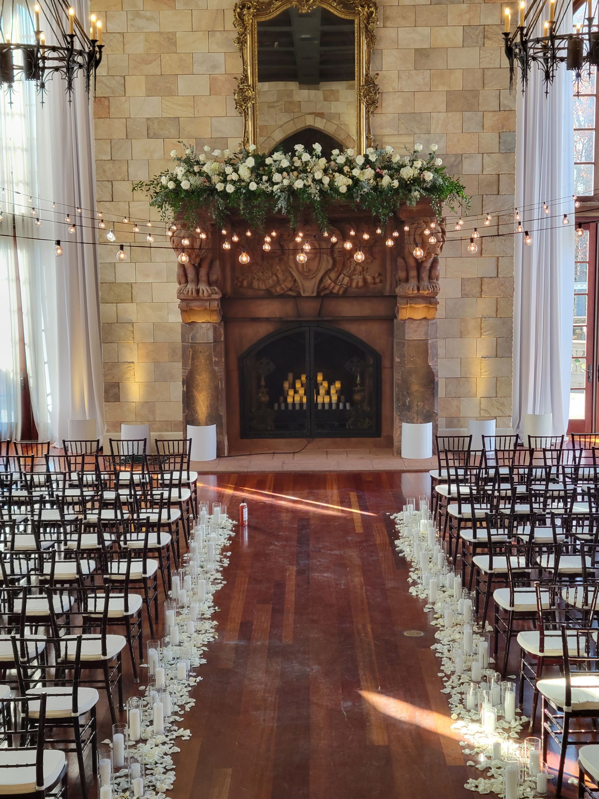 A row of chairs lined up in front of a fireplace