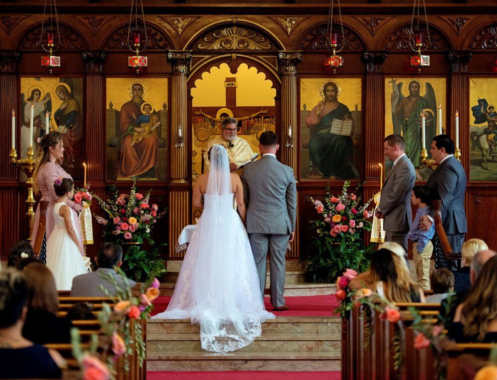 A bride and groom are getting married in a church