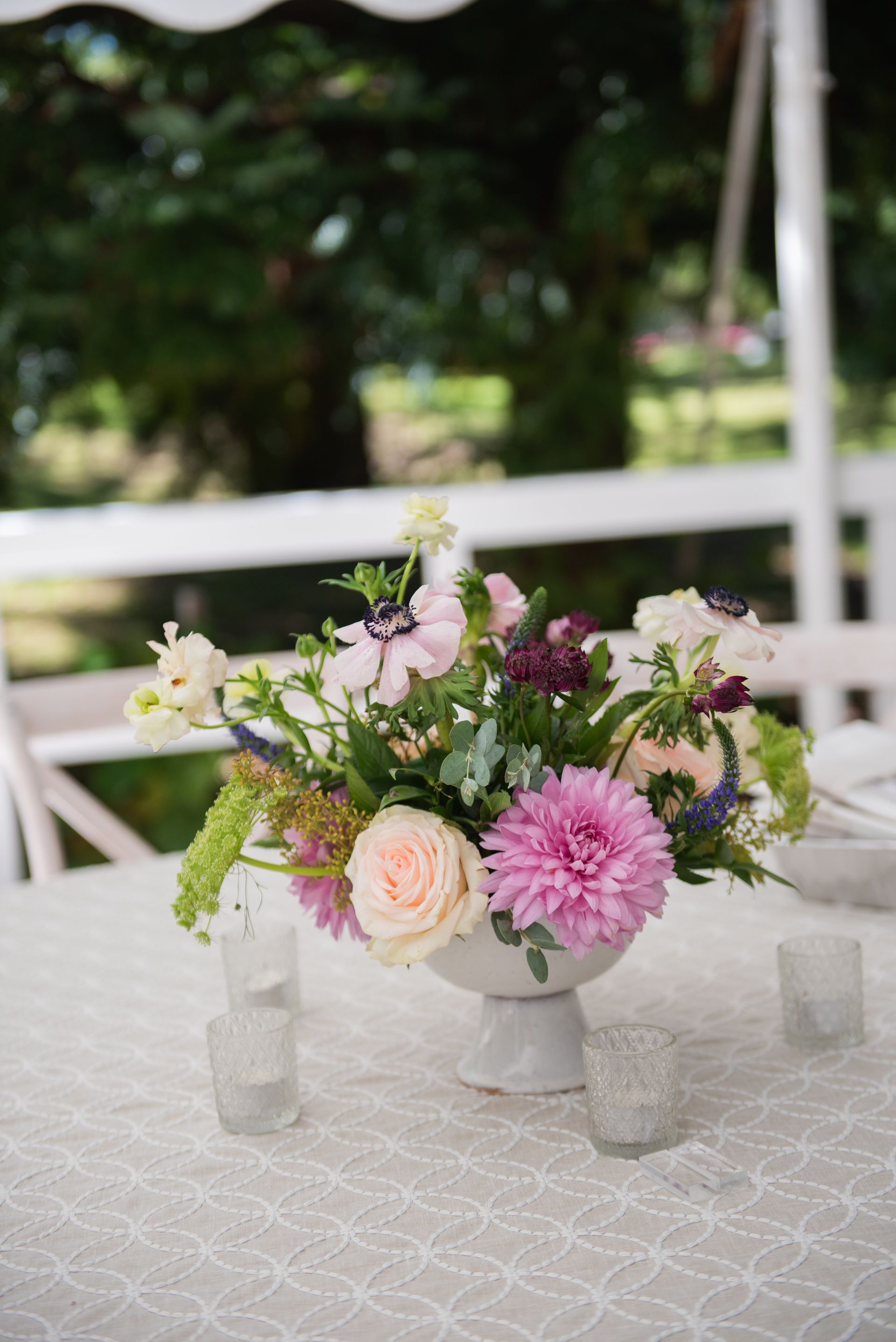 A vase filled with flowers is sitting on a table.