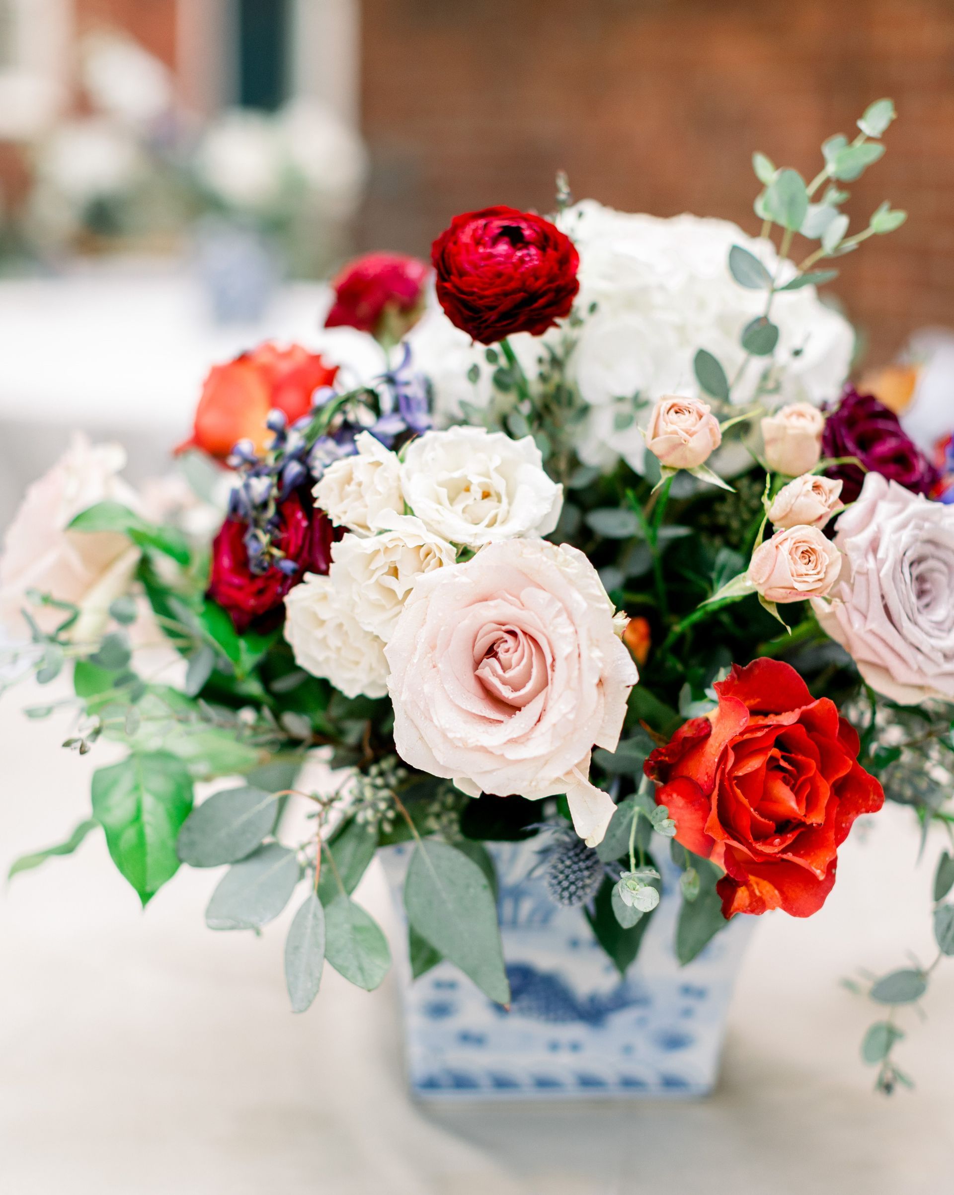 A vase filled with flowers is sitting on a table.