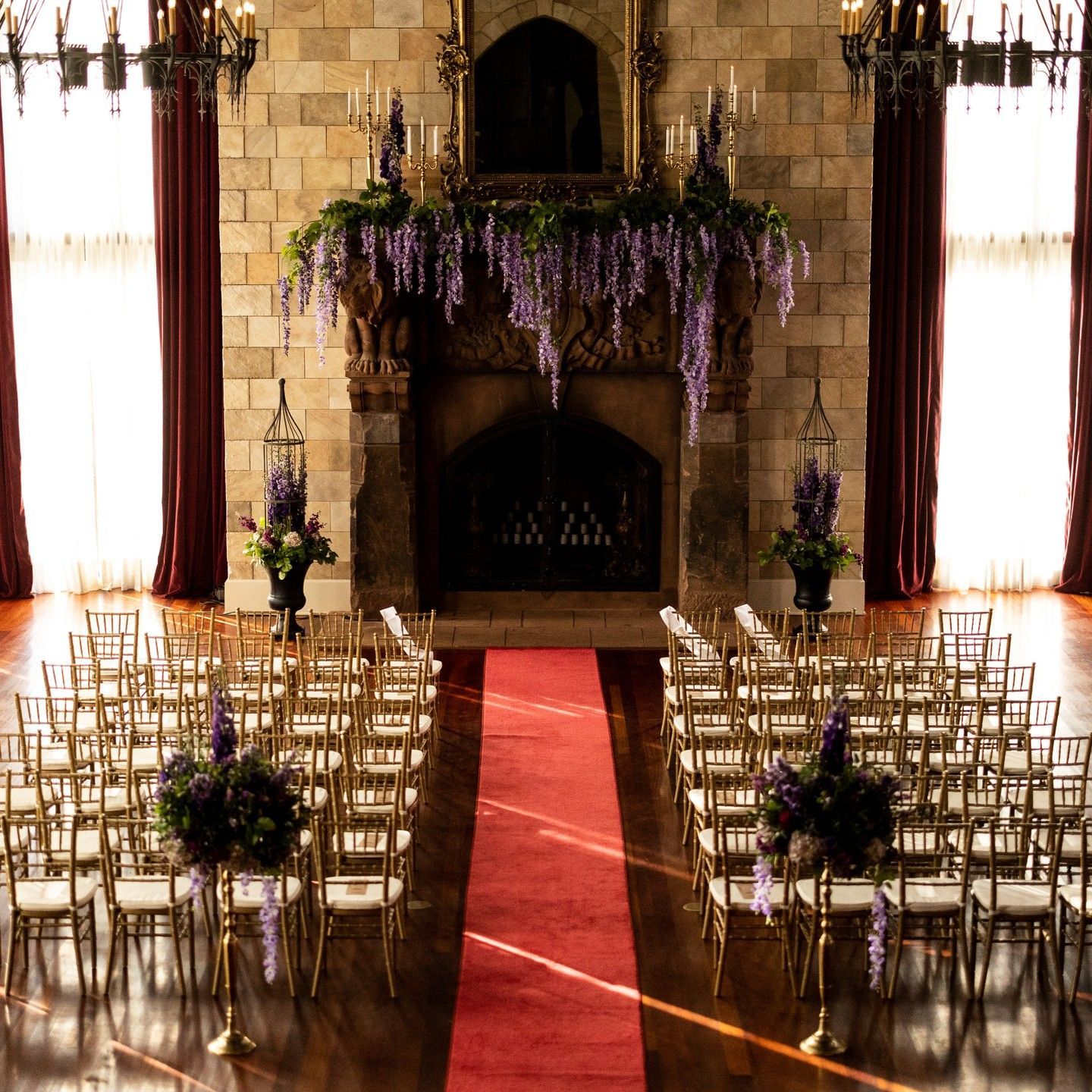 Rows of chairs are lined up in front of a fireplace