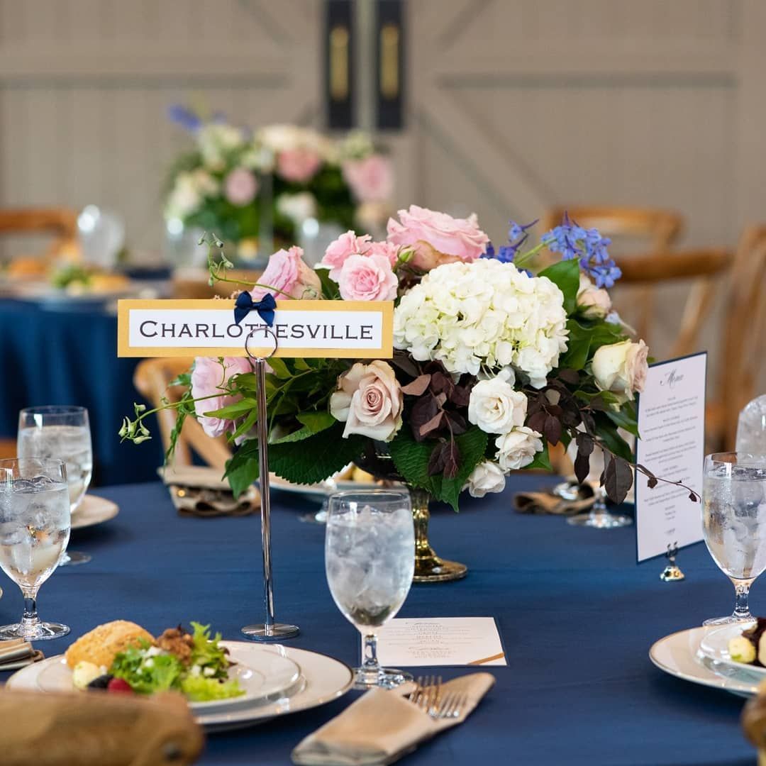 A table with a sign that says charlottesville on it