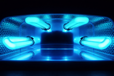 Blue UV-lit sterilization chamber with glowing lamps inside a metallic enclosure