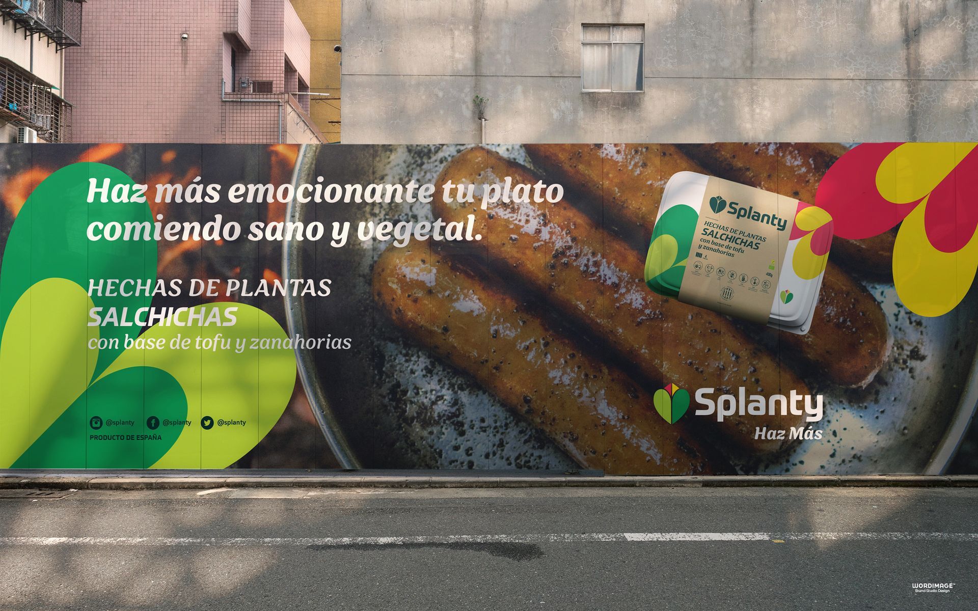 A billboard on the side of a building advertising splatty sausages