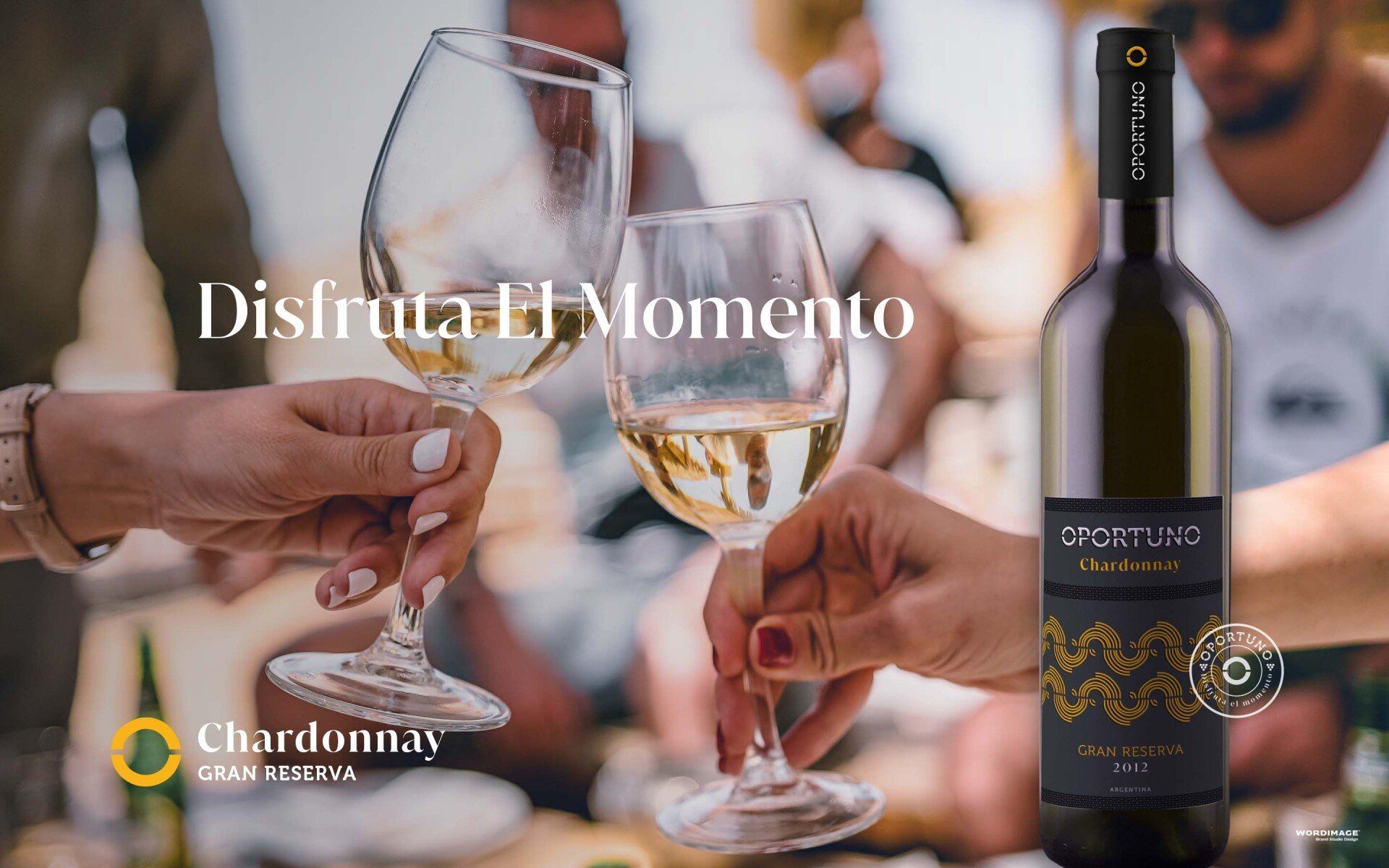 A bottle of chardonnay is next to a group of people holding wine glasses.