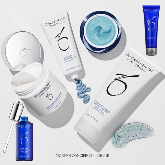 A variety of zo skin health products are laid out on a table