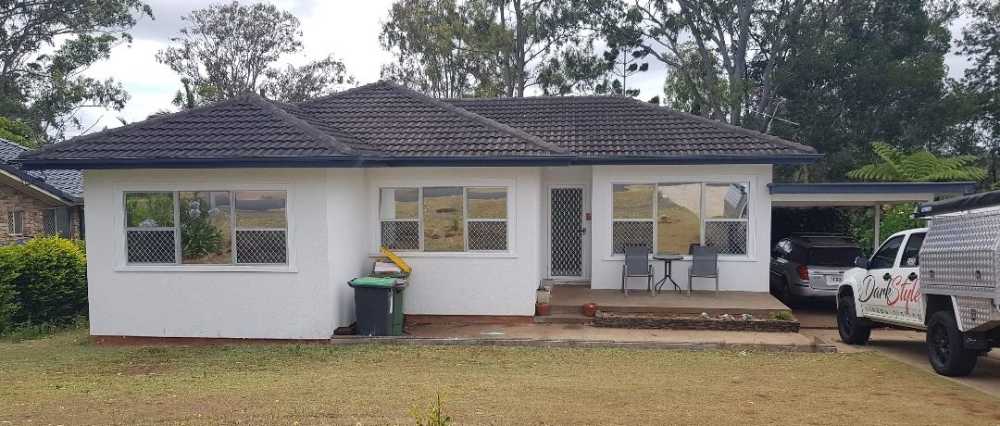 White and Grey House with Tinted Window— Darkstyle Tinting in South Lismore, NSW