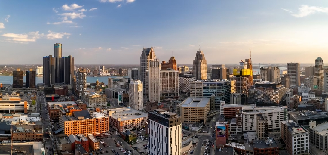 An aerial view of a city skyline at sunset.