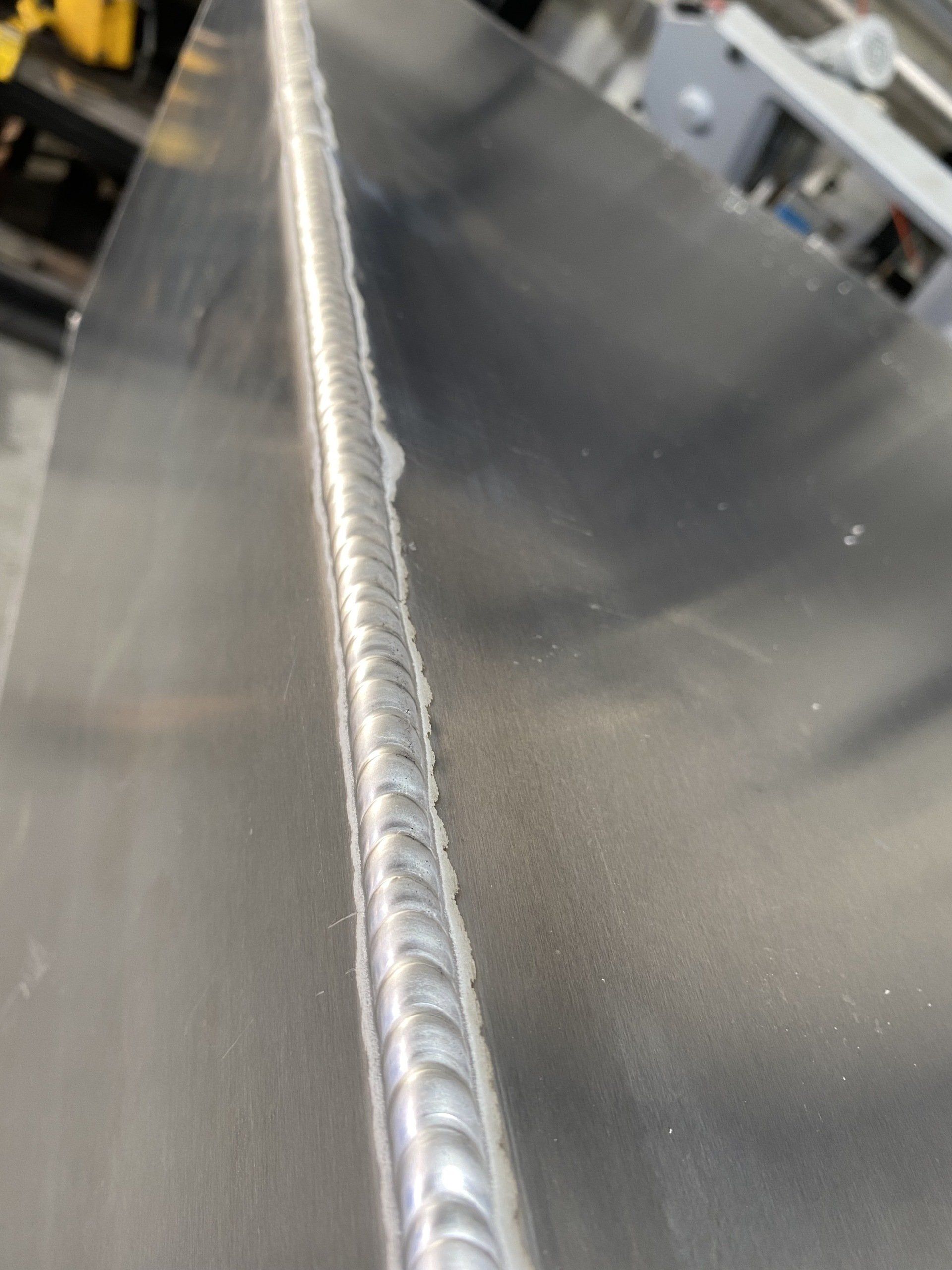 A Close Up of a Piece of Metal With a Welding Joint — EB Metalworks in Somersby, NSW