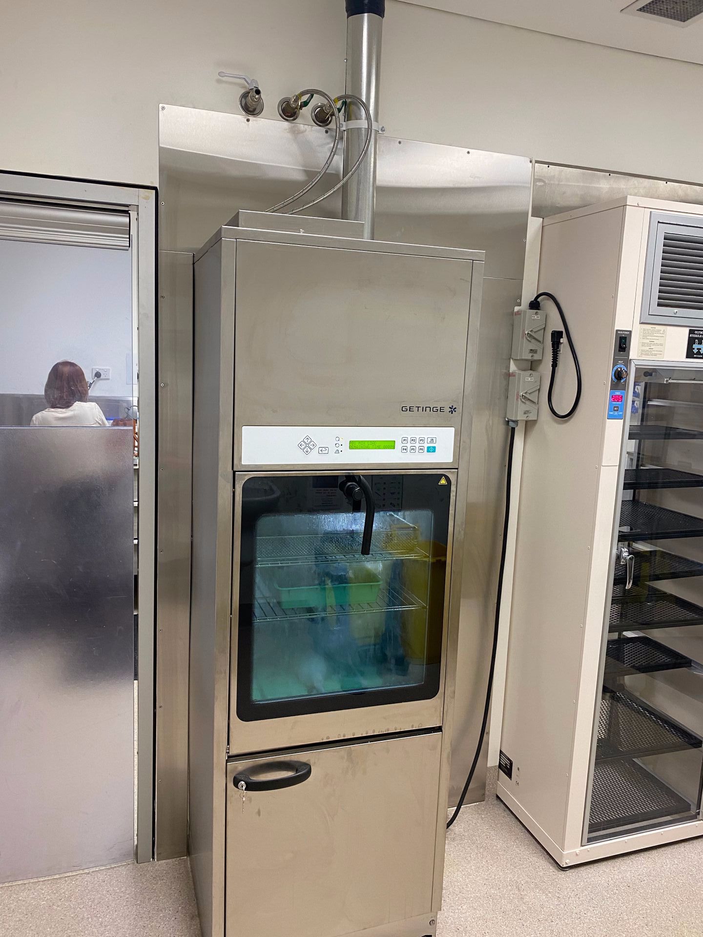 A Stainless Steel Refrigerator is Sitting in a Room — EB Metalworks in Somersby, NSW