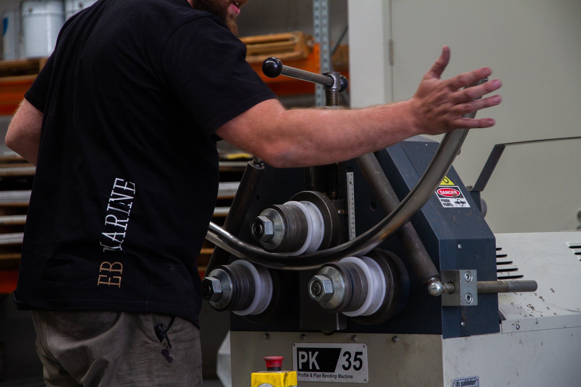 A Man is Working on a Machine That Says Pk 35 on It — EB Metalworks in Somersby, NSW