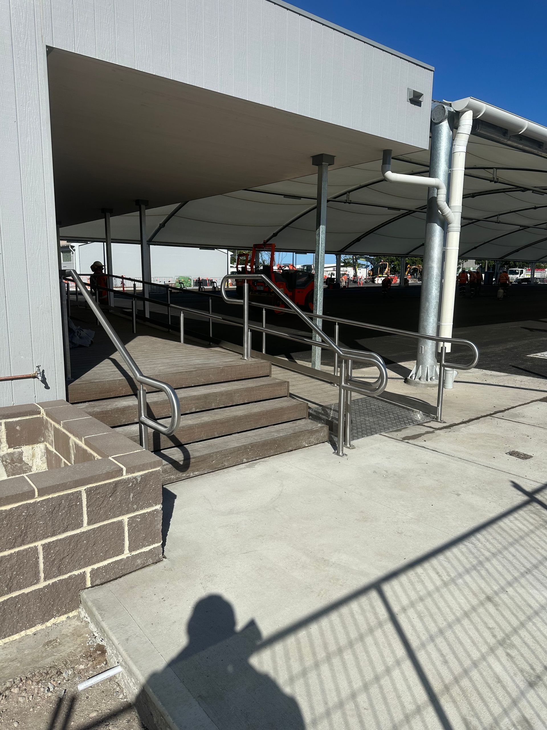 A Row of Stainless Steel Walls With a Lot of Windows in a Room — EB Metalworks in Somersby, NSW
