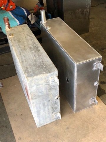Two Rectangular Metal Tanks or Containers Standing Upright on A Concrete Floor — EB Metalworks in Somersby, NSW