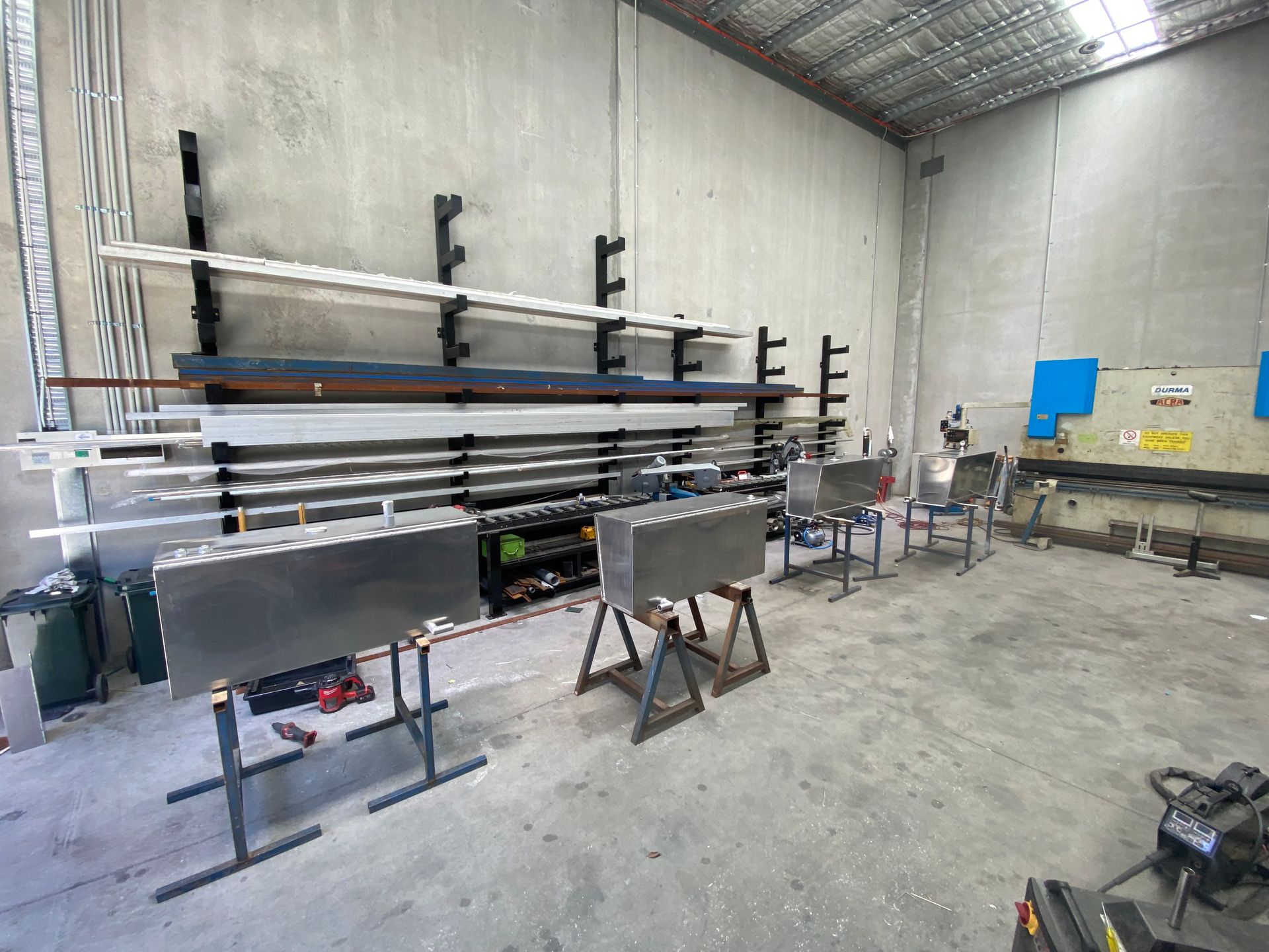 A Warehouse Filled With Lots of Metal Pieces and Machinery — EB Metalworks in Kincumber, NSW