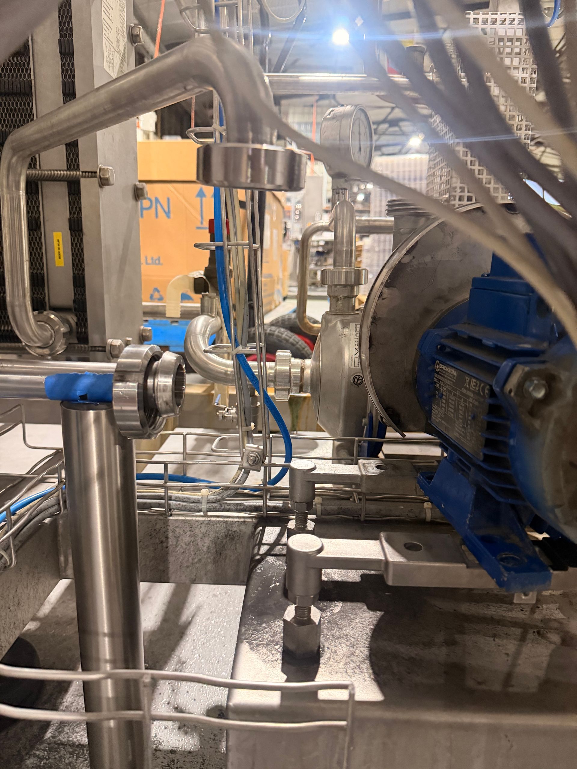 Industrial Machinery with Blue Motor, Silver Pipes, and Ducts — EB Metalworks in Macquarie Park, NSW