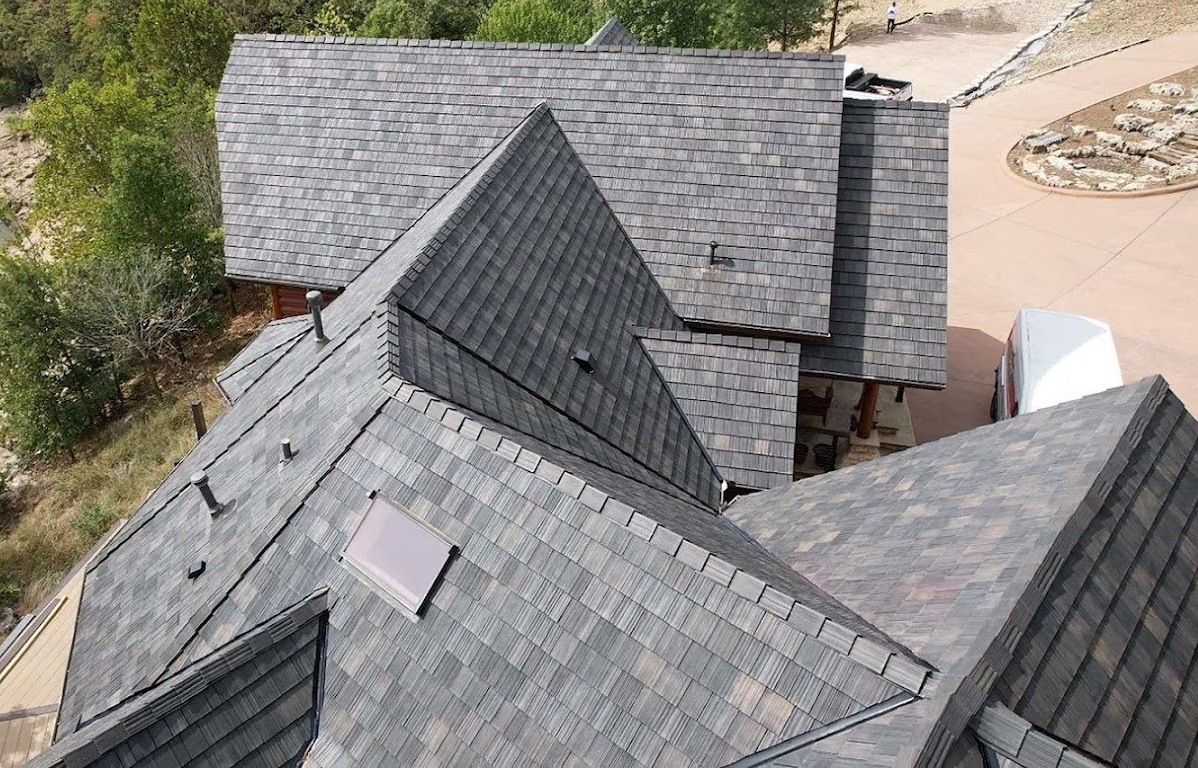 Recent residential roof replacement completed by Roofing and Gutter Experts in Northwest Arkansas