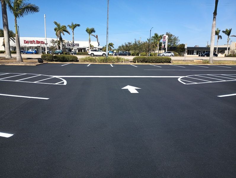 A parking lot with an arrow pointing to the right