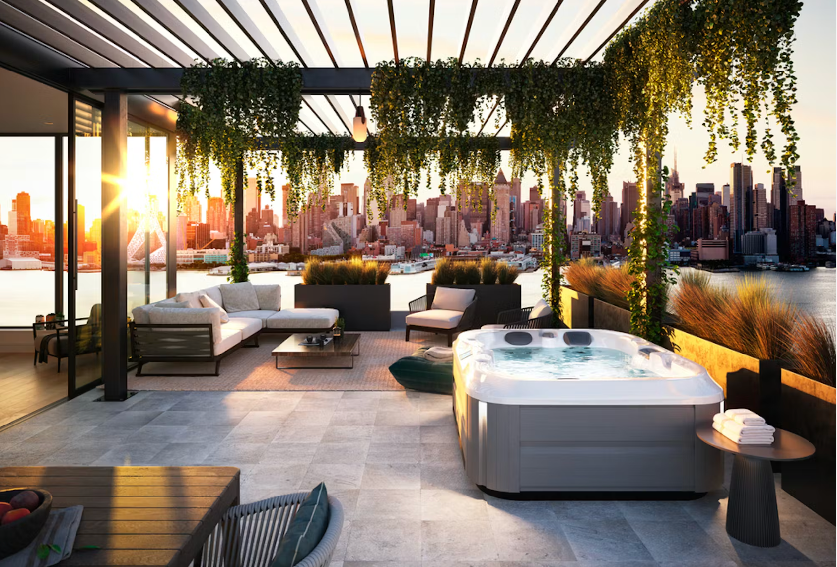 Spa sur une terrasse avec plantes verte vue sur un couché de soleil