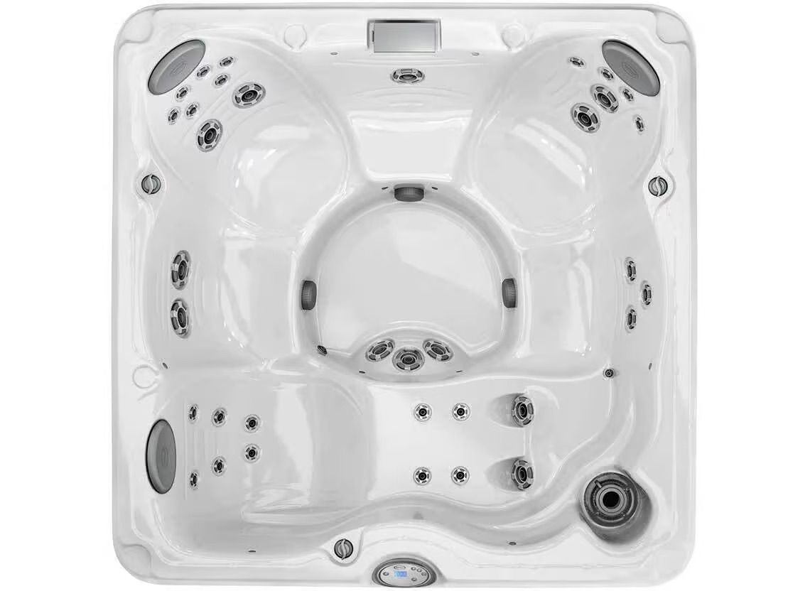Un jacuzzi blanc avec beaucoup de jets sur fond blanc.