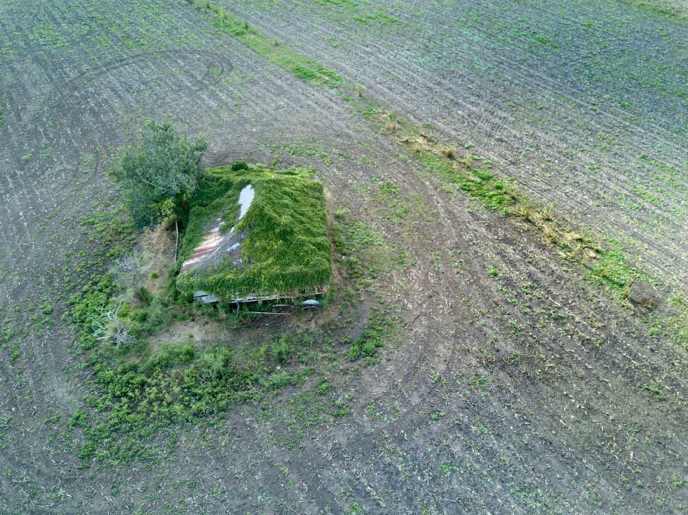 An Aerial View of A Small House in The Middle of A Field — CK's Milling & Earthworks in Goomeri, QLD
