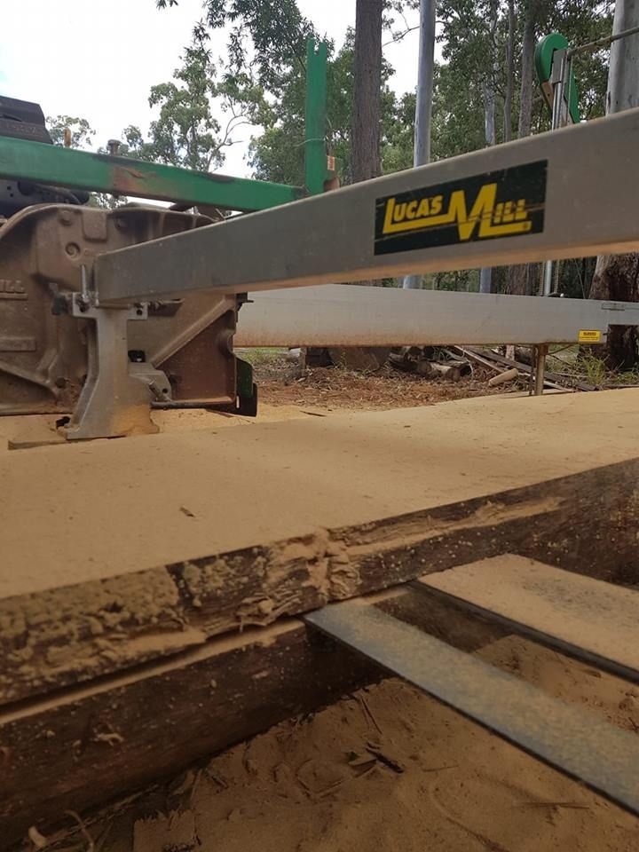 A Lucas Mill Machine Is Cutting a Piece of Wood — CK's Milling & Earthworks in Bells Bridge, QLD