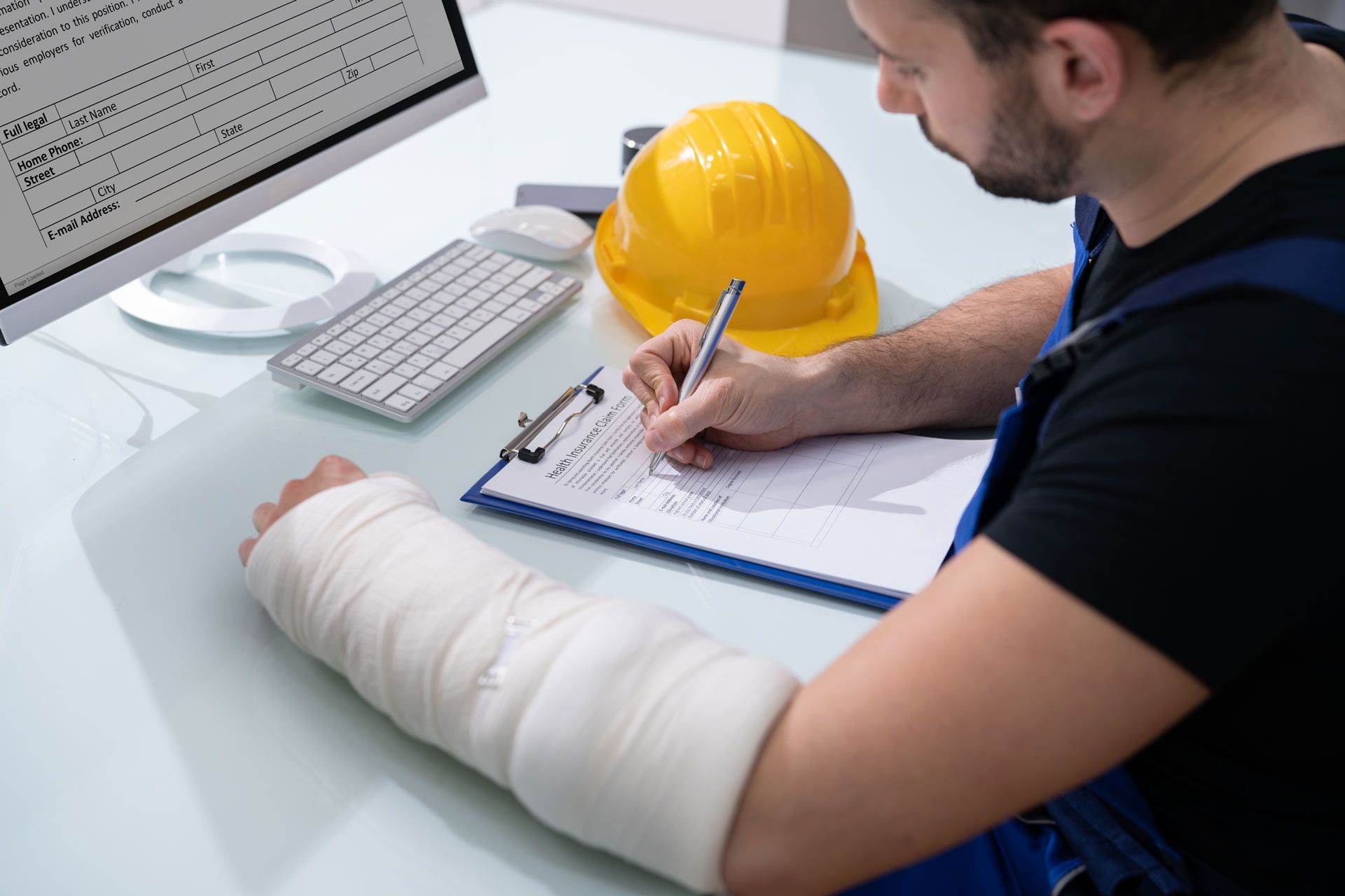 Injured Man Writing on Health Insurance Form