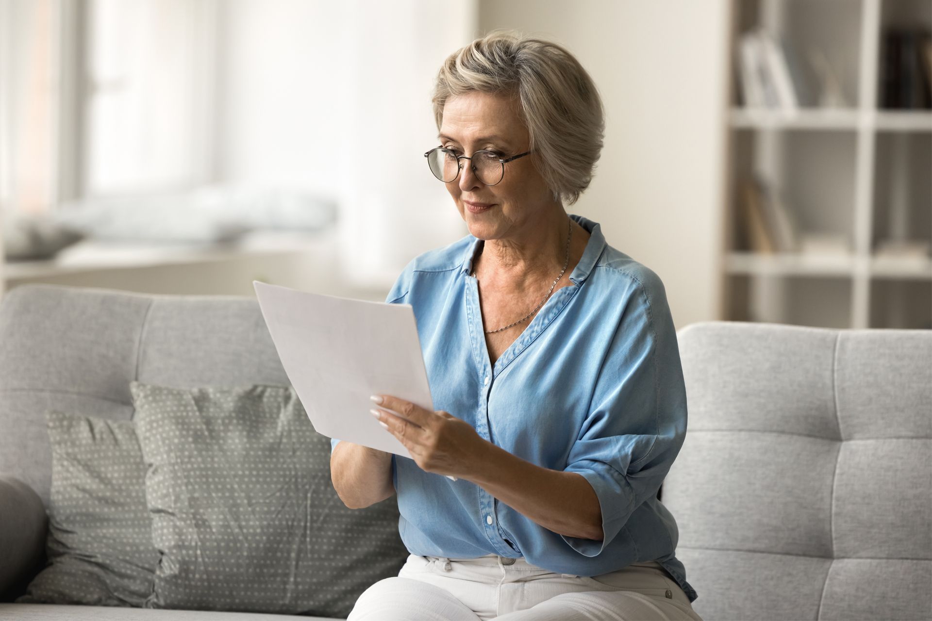 Senior Woman Looking at the Paper