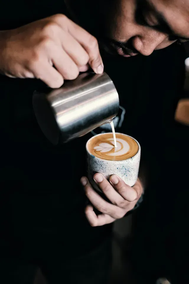 Pouring coffee in a cup 