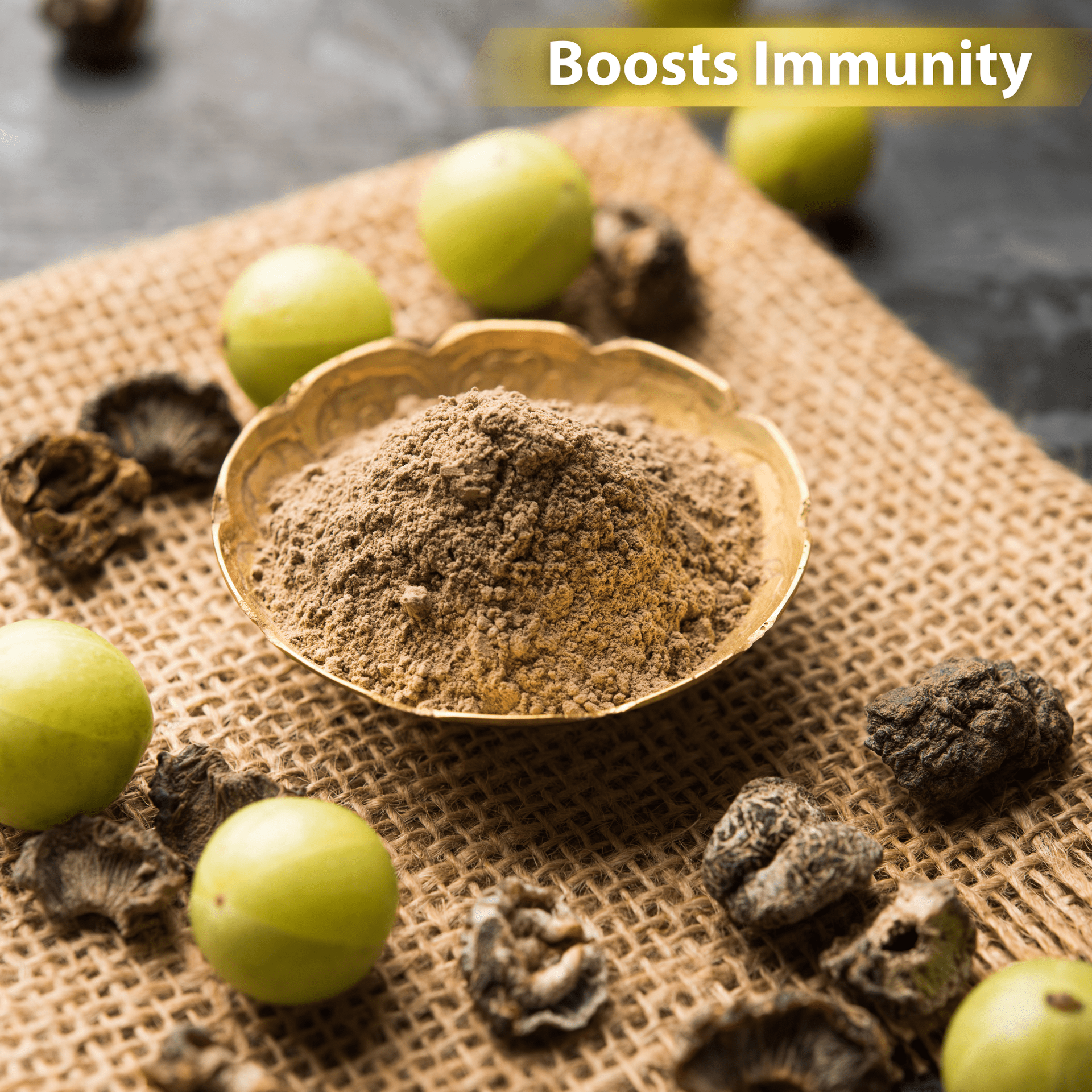 Amla powder in a bowl, surrounded by fresh amla fruits and dried amla, on a burlap cloth,