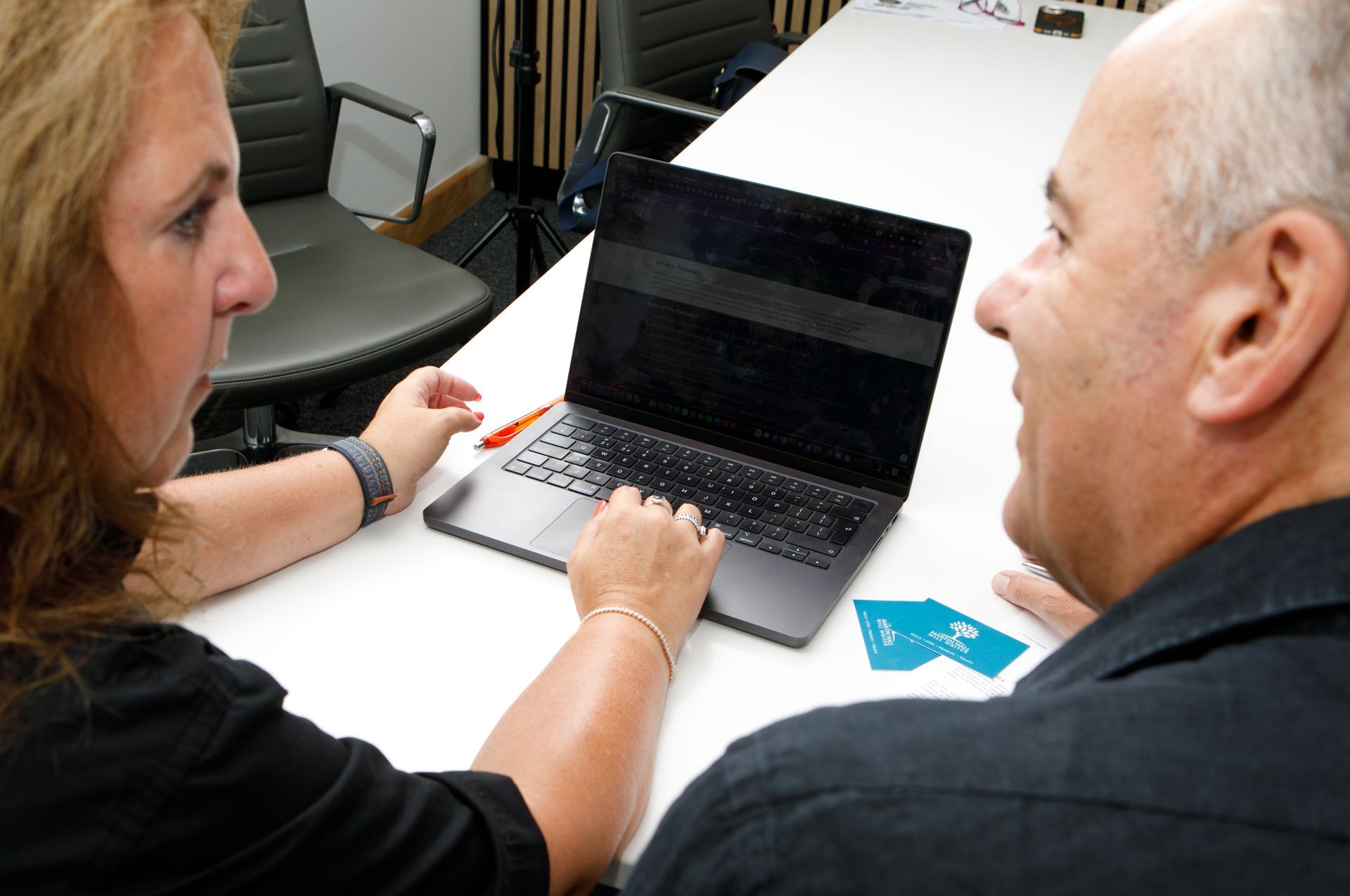 Man at desk with computer, searching