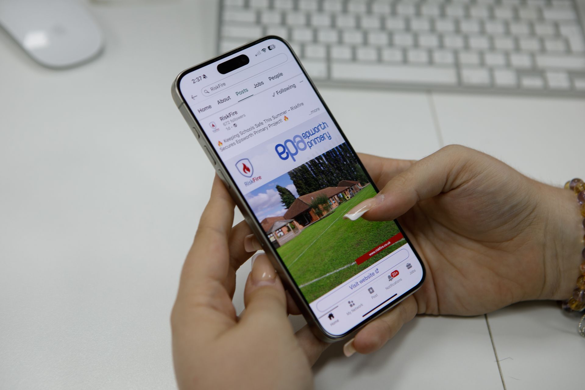 Hands hold a smartphone displaying the