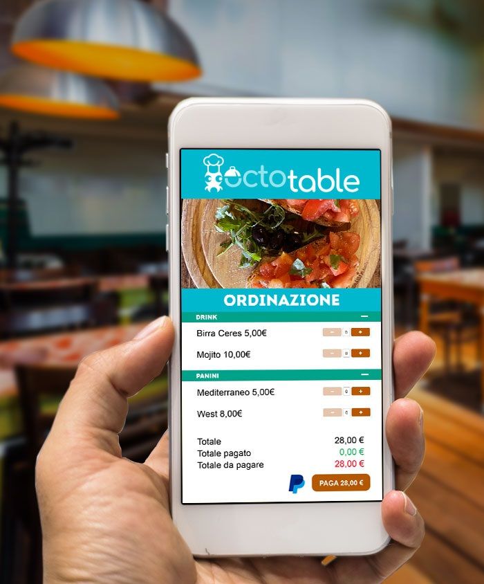 A hand holding a phone showing an OctoTable food ordering app in a restaurant setting.
