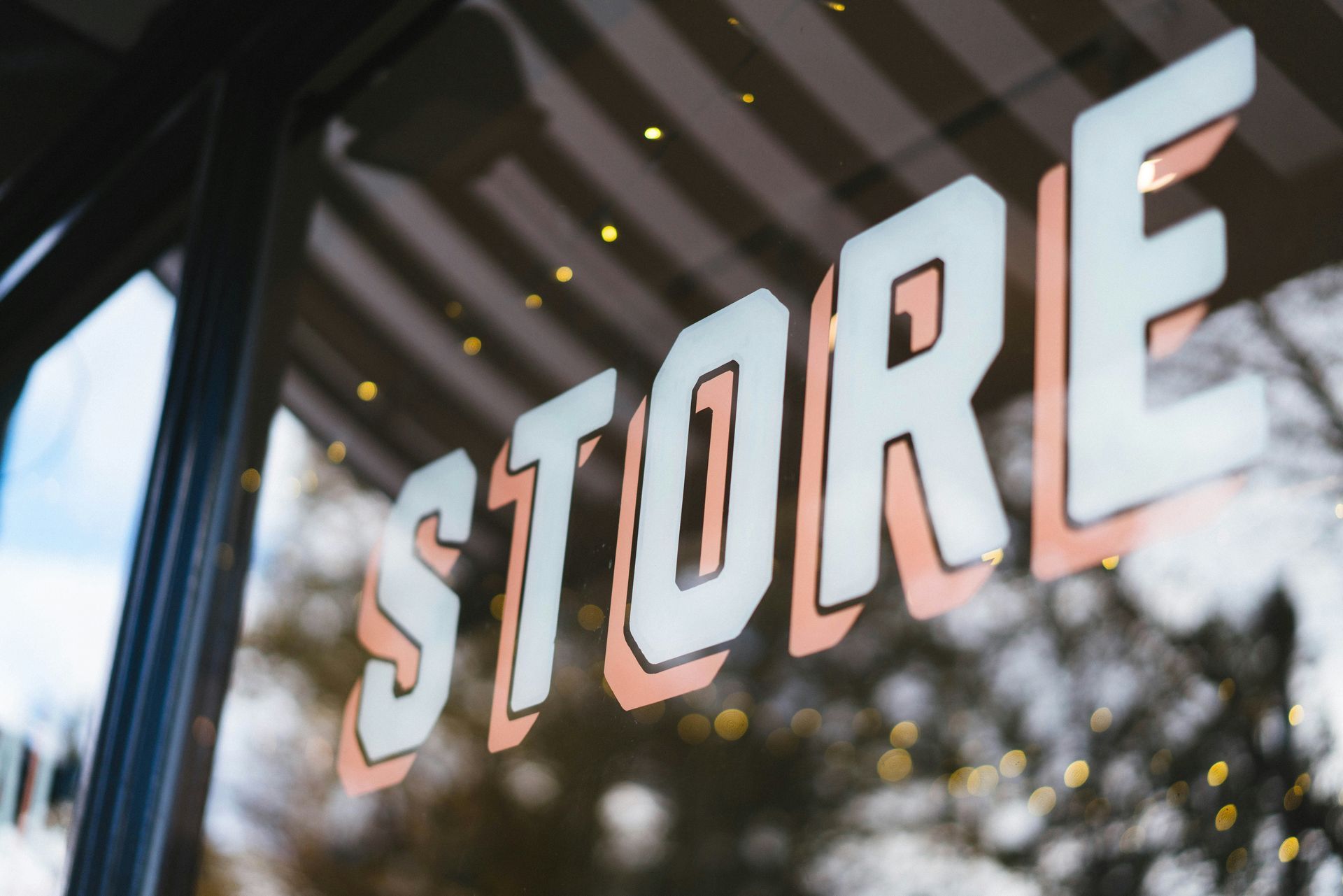 STORE sign in large white letters on a glass storefront window